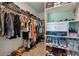 Walk-in closet with custom shelving and ample storage for clothes and shoes at 1484 Ben Park Way, Grayson, GA 30017