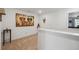 Hallway space with bright white walls, neutral carpet, and colorful elephant art at 1484 Ben Park Way, Grayson, GA 30017