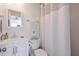 Clean bathroom features a white vanity, toilet, and stylish shower curtain at 160 Vine Nw St, Atlanta, GA 30314