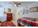 Bedroom featuring a patterned bedspread, ceiling fan, and wooden dresser at 160 Vine Nw St, Atlanta, GA 30314