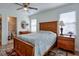 Spacious bedroom features a wooden bed frame, side tables, and connecting bathroom at 160 Vine Nw St, Atlanta, GA 30314