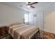 Simple bedroom features a ceiling fan, natural light, and neutral decor at 160 Vine Nw St, Atlanta, GA 30314