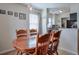 Well lit dining room area features light wood floors and seating for four at 160 Vine Nw St, Atlanta, GA 30314