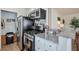 Modern kitchen with stainless steel appliances, granite countertops, and stylish backsplash at 160 Vine Nw St, Atlanta, GA 30314
