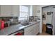 Updated kitchen featuring granite countertops, stainless steel sink, and modern backsplash at 160 Vine Nw St, Atlanta, GA 30314