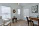 Bright sunroom with natural light, cozy seating, and a work desk area at 160 Vine Nw St, Atlanta, GA 30314