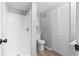 Bathroom featuring a walk-in shower, toilet, and a closet at 2735 Varlet Ct, Snellville, GA 30039