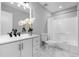 This bathroom offers a vanity with double sinks, and a shower and tub combination at 2735 Varlet Ct, Snellville, GA 30039