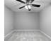 Neutral bedroom featuring plush carpeting and modern ceiling fan at 2735 Varlet Ct, Snellville, GA 30039