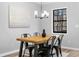Modern dining room featuring stylish light fixture and dining table with seating for four at 2735 Varlet Ct, Snellville, GA 30039