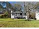 Charming renovated home with lush green lawn and professional landscaping at 2735 Varlet Ct, Snellville, GA 30039