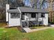 An updated home featuring a gray roof, white siding, and black trim at 2735 Varlet Ct, Snellville, GA 30039