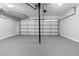 Spacious garage with a white door and overhead lighting at 2735 Varlet Ct, Snellville, GA 30039