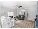 Bright living room boasts hardwood floors, a cozy fireplace, and neutral color scheme at 2735 Varlet Ct, Snellville, GA 30039