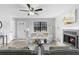 Cozy living room featuring a fireplace, hardwood floors, and a bright, neutral decor at 2735 Varlet Ct, Snellville, GA 30039