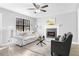 Stylish living room with hardwood floors, fireplace, and comfortable furniture at 2735 Varlet Ct, Snellville, GA 30039