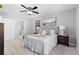 Cozy main bedroom featuring a ceiling fan, carpet floors, natural light, and a walk-in closet at 2735 Varlet Ct, Snellville, GA 30039