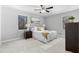 Comfortable main bedroom with carpet, two windows and neutral paint, creating a calming space at 2735 Varlet Ct, Snellville, GA 30039