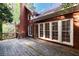 Brick house featuring a wooden deck at 3117 Kings Arms Ne Ct, Atlanta, GA 30345