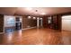 Spacious basement featuring wood floors, stylish lighting, and a built-in bookshelf at 3117 Kings Arms Ne Ct, Atlanta, GA 30345