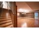 Finished basement with wood-look flooring and a door leading to the outside at 3117 Kings Arms Ne Ct, Atlanta, GA 30345