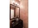 Stylish powder room with a unique vessel sink and decorative mirror at 3117 Kings Arms Ne Ct, Atlanta, GA 30345