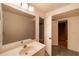 The bathroom has a large mirror over the sink with a door leading to a stairwell at 3117 Kings Arms Ne Ct, Atlanta, GA 30345