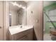 Bathroom featuring a sink vanity, large mirror, neutral color, and toilet at 3117 Kings Arms Ne Ct, Atlanta, GA 30345
