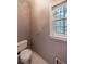 Bathroom with a toilet and a window with a view to the outside at 3117 Kings Arms Ne Ct, Atlanta, GA 30345