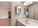 Bright bathroom with white cabinets, sink, and a well-lit mirror at 3117 Kings Arms Ne Ct, Atlanta, GA 30345