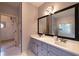 Bathroom with double vanity, framed mirror, and decorative lighting at 3117 Kings Arms Ne Ct, Atlanta, GA 30345