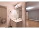 Bright bathroom features a single sink vanity with updated lighting and opens to the main bedroom at 3117 Kings Arms Ne Ct, Atlanta, GA 30345