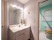 Well-lit bathroom featuring a single vanity and adjacent toilet/shower room at 3117 Kings Arms Ne Ct, Atlanta, GA 30345