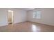 Spacious bedroom with natural light, hardwood floors and an adjoining bathroom, creating a comfortable retreat at 3117 Kings Arms Ne Ct, Atlanta, GA 30345