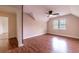 Bedroom featuring hardwood floors, a ceiling fan, and a window overlooking the yard at 3117 Kings Arms Ne Ct, Atlanta, GA 30345