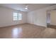 Bedroom with hardwood floors, a window with natural light, and a closet for easy storage at 3117 Kings Arms Ne Ct, Atlanta, GA 30345