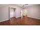 Spacious bedroom with hardwood floors, large closet, ceiling fan, and neutral paint at 3117 Kings Arms Ne Ct, Atlanta, GA 30345