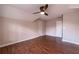 Bedroom featuring hardwood floors, a ceiling fan, and neutral colored walls at 3117 Kings Arms Ne Ct, Atlanta, GA 30345