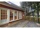 Spacious wooden deck with railing, accessible through glass doors at 3117 Kings Arms Ne Ct, Atlanta, GA 30345