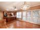 Open-concept dining room that flows into the kitchen area and features a modern chandelier at 3117 Kings Arms Ne Ct, Atlanta, GA 30345