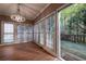 Dining room featuring a chandelier, windows and access to a wooden deck at 3117 Kings Arms Ne Ct, Atlanta, GA 30345