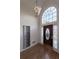 Elegant foyer with hardwood floors, chandelier, and large window above front door at 3117 Kings Arms Ne Ct, Atlanta, GA 30345