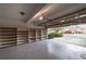 Two car garage with a partially opened door and lots of storage space with built-in shelving at 3117 Kings Arms Ne Ct, Atlanta, GA 30345