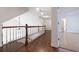 Hallway features hardwood floors, white trim, and natural light creating a warm and inviting space at 3117 Kings Arms Ne Ct, Atlanta, GA 30345