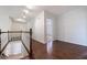 Hallway with hardwood floors and white trim, offering a bright and open feel to the home at 3117 Kings Arms Ne Ct, Atlanta, GA 30345