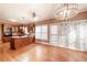 Open-concept kitchen featuring granite countertops, dark wood cabinets, stainless steel appliances, and hardwood floors at 3117 Kings Arms Ne Ct, Atlanta, GA 30345
