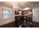 Kitchen with stainless steel appliances, dark wood cabinets, and a chandelier at 3117 Kings Arms Ne Ct, Atlanta, GA 30345