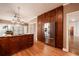 Kitchen with stainless steel appliances, dark wood cabinets, granite countertops, and hardwood floors at 3117 Kings Arms Ne Ct, Atlanta, GA 30345