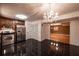 Modern kitchen featuring stainless steel appliances, dark cabinets, and black tile flooring at 3117 Kings Arms Ne Ct, Atlanta, GA 30345