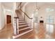 Bright living room with high ceilings, fireplace, and large windows offering natural light and views at 3117 Kings Arms Ne Ct, Atlanta, GA 30345